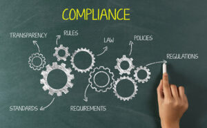 compliance concept on chalkboard