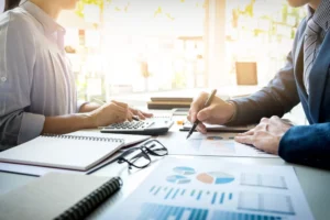 business man financial inspector secretary making report calculating checking balance internal revenue service inspector checking document audit concept 2 scaled 1 2048x1366