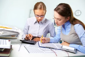 businesswomen reviewing results 1 1 scaled 1